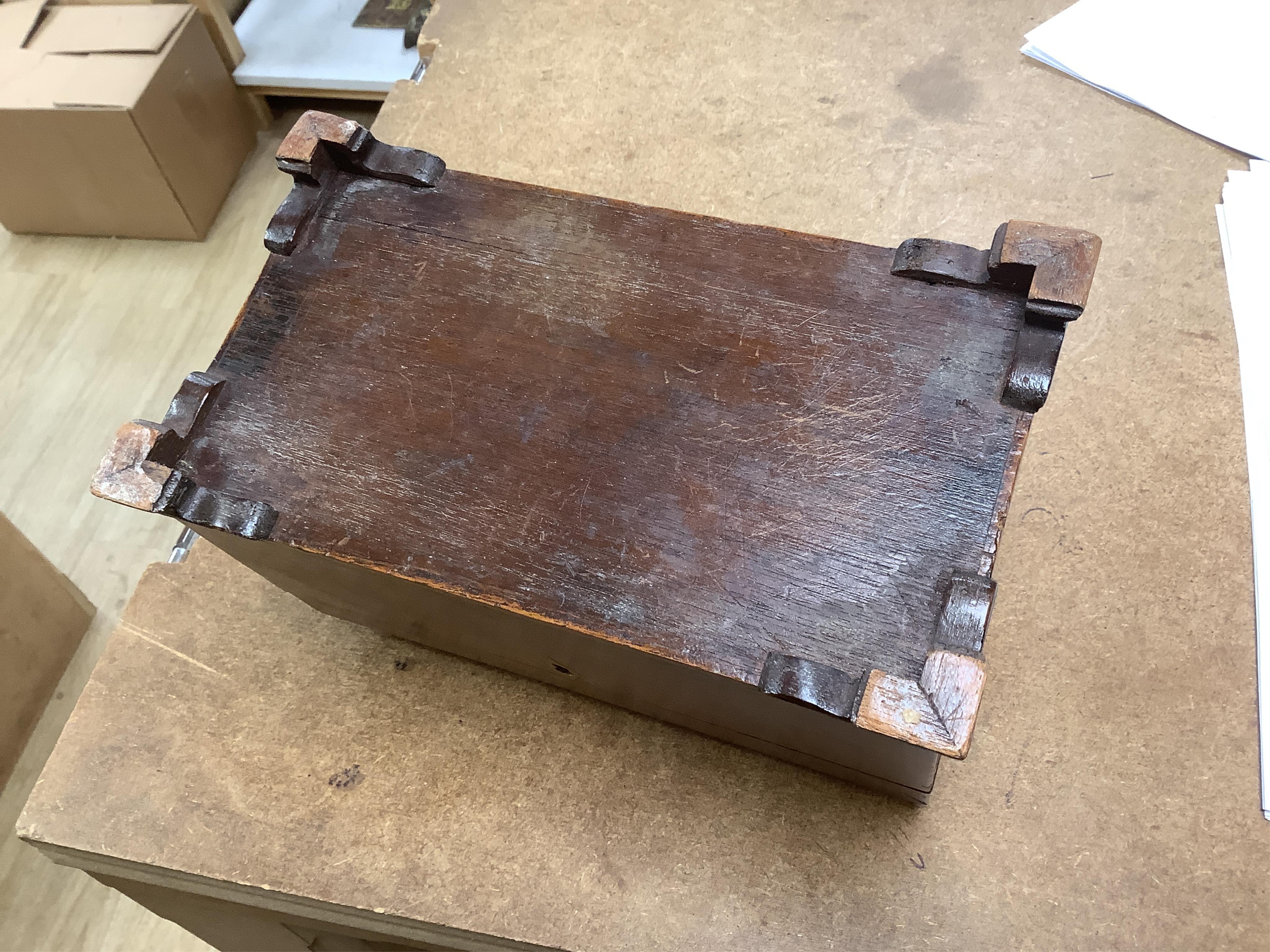 A George III mahogany tea caddy, containing tinned metal canisters, 25cm wide